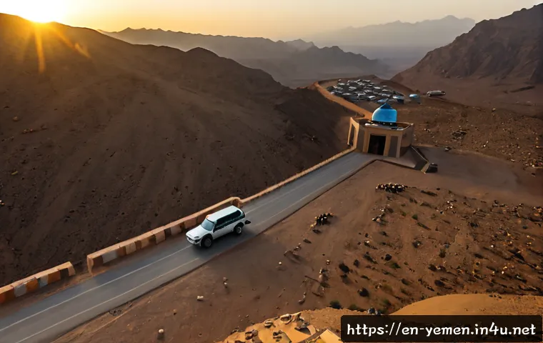 예멘과 인접 국가의 국경 분쟁 - Photorealistic aerial view of a remote Yemen border checkpoint in arid mountains, a simple barrier g...